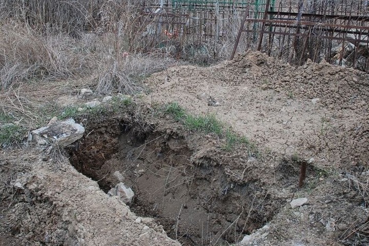 Два брата из Кузбасса раскопали чужую могилу, планируя положить туда еще одно тело